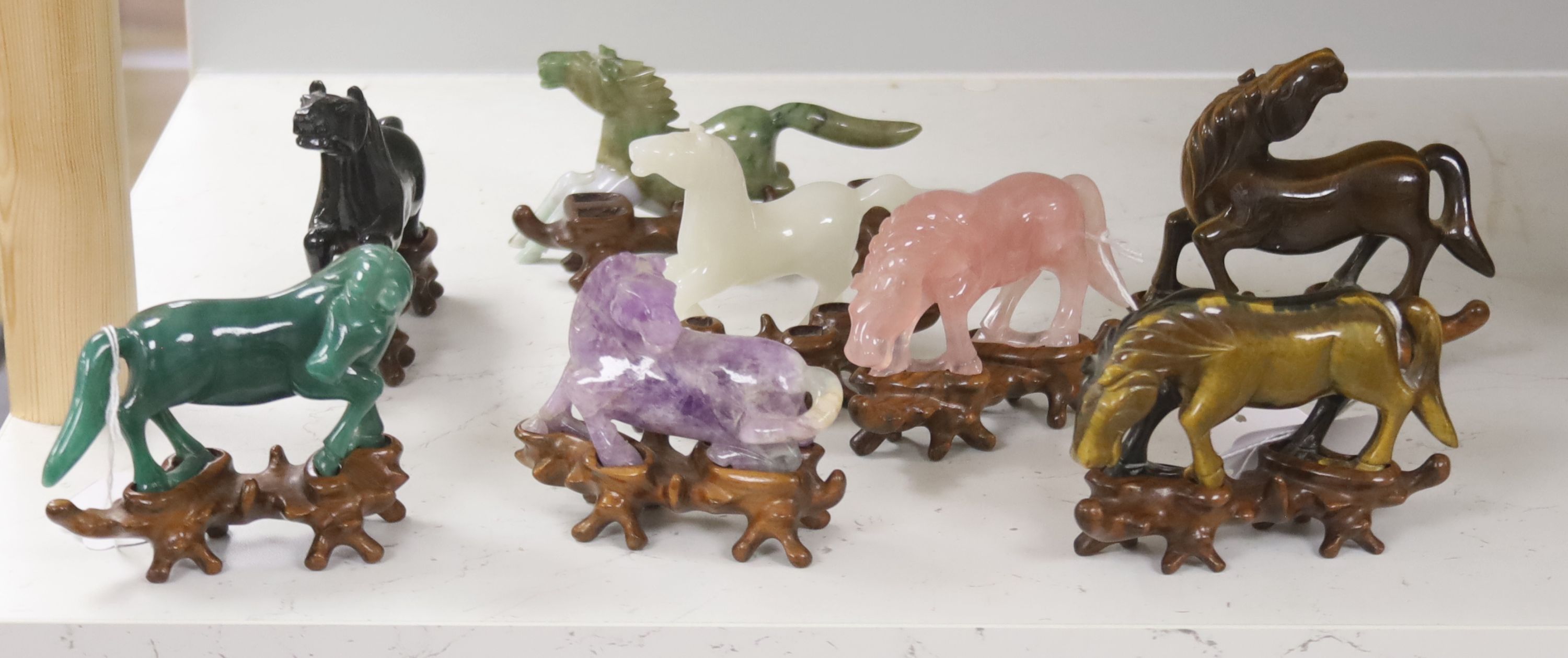 Eight Chinese 20th century carved hardstone 'Horses of Mu Wang'